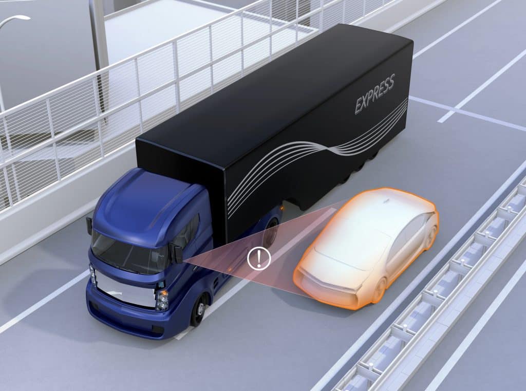 Depositphotos_155661458_L Illustration of a semi-truck’s blind spot with a passenger car positioned alongside the trailer.