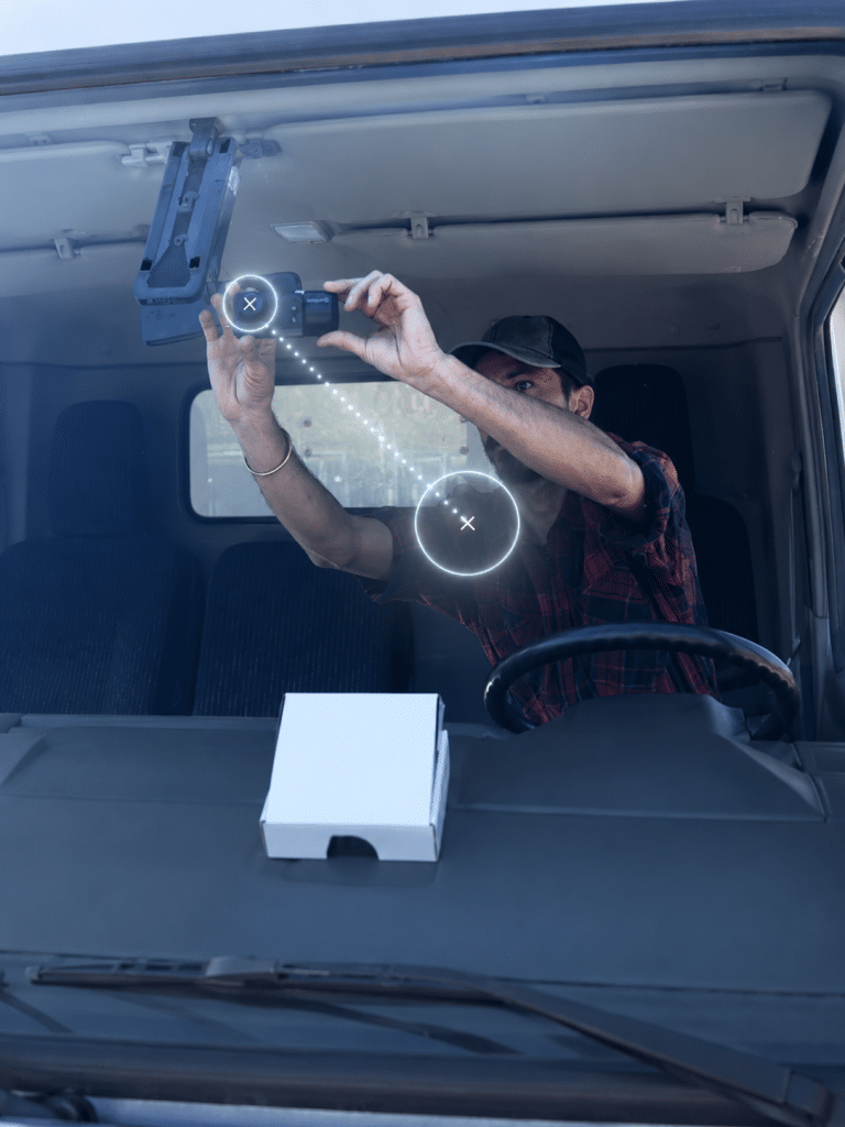 Installation Fleet dash cam installation on commercial truck windshield
